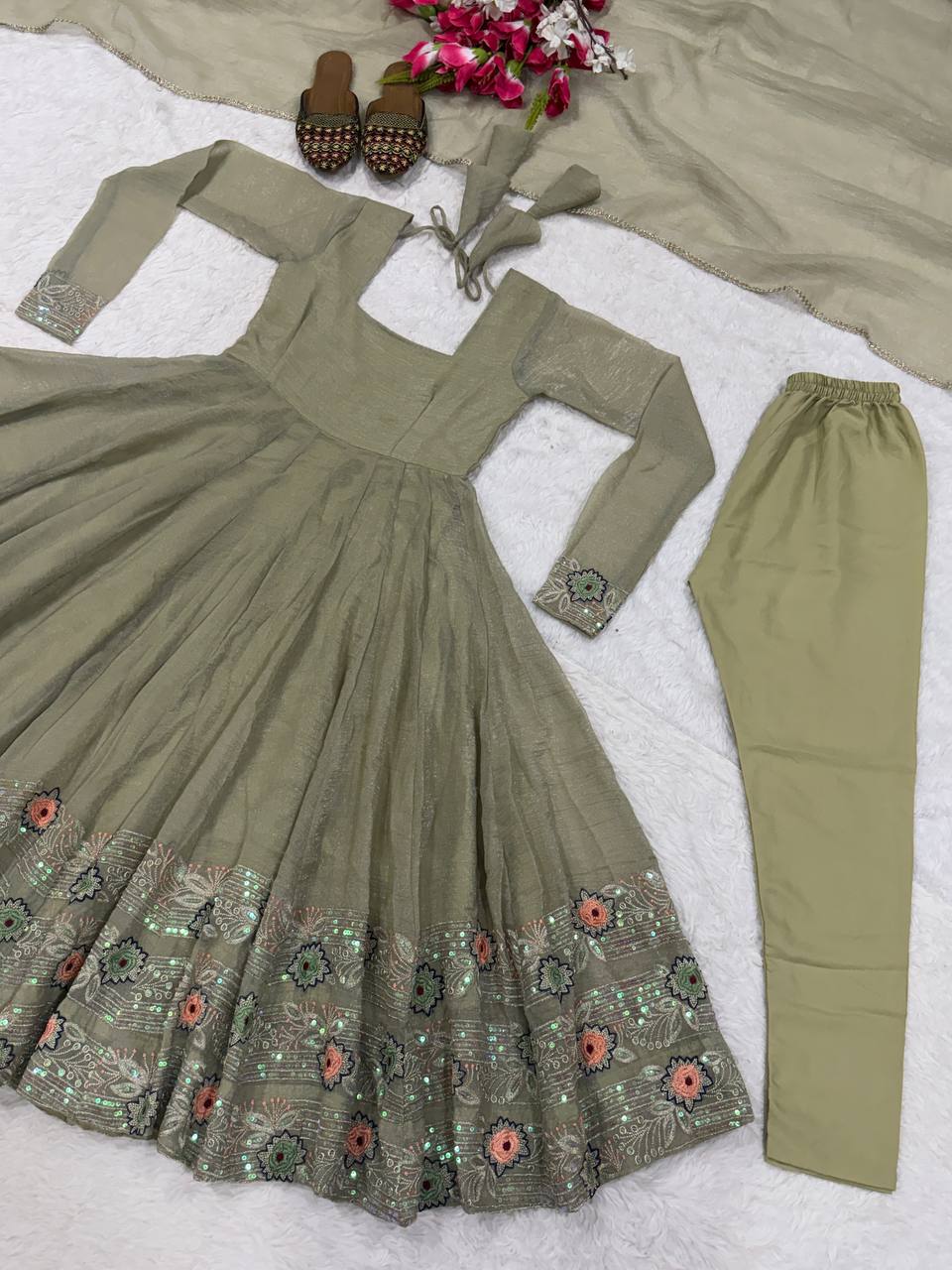 Ethereal Mehendi Green Flared Anarkali Suit Set Adorned with Luminous Sequined Floral Motifs, Embroidered Cuffs, and an Ornate Heritage Hem